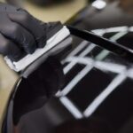 Man,Wearing,Black,Gloves,Applying,Ceramic,Coating,To,Car,Using