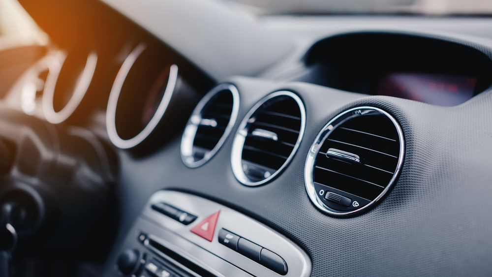 Close-up,Of,Air,Vent,In,Car.,Red,Emergency,Button,On