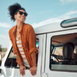 Black,Woman,On,Road,,Enjoying,Window,View,Of,Desert,And