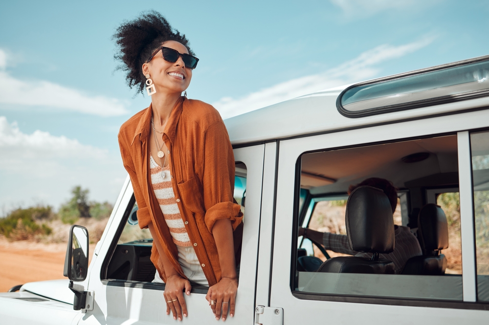 Black,Woman,On,Road,,Enjoying,Window,View,Of,Desert,And